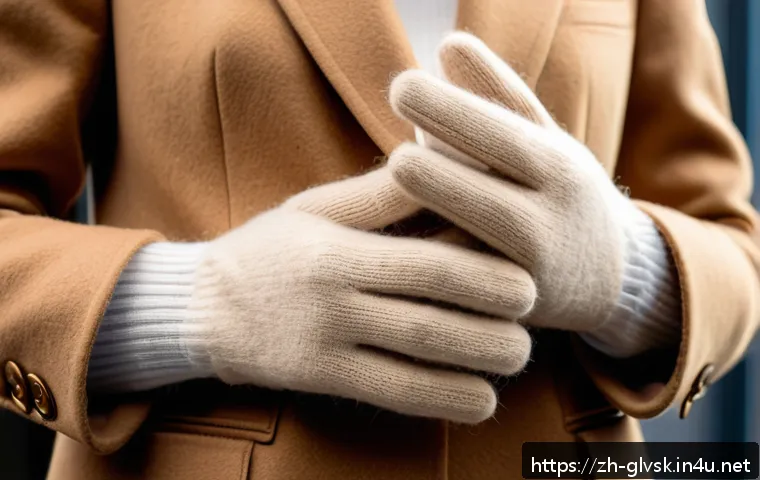 패션 장갑 스타일 추천 - A close-up image of a pair of luxurious cashmere gloves worn by a person with light skin tone, showc...