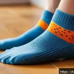 실내 운동용 논슬립 양말 - A close-up view of a pair of anti-slip socks made from a cotton blend, worn on clean wooden flooring...